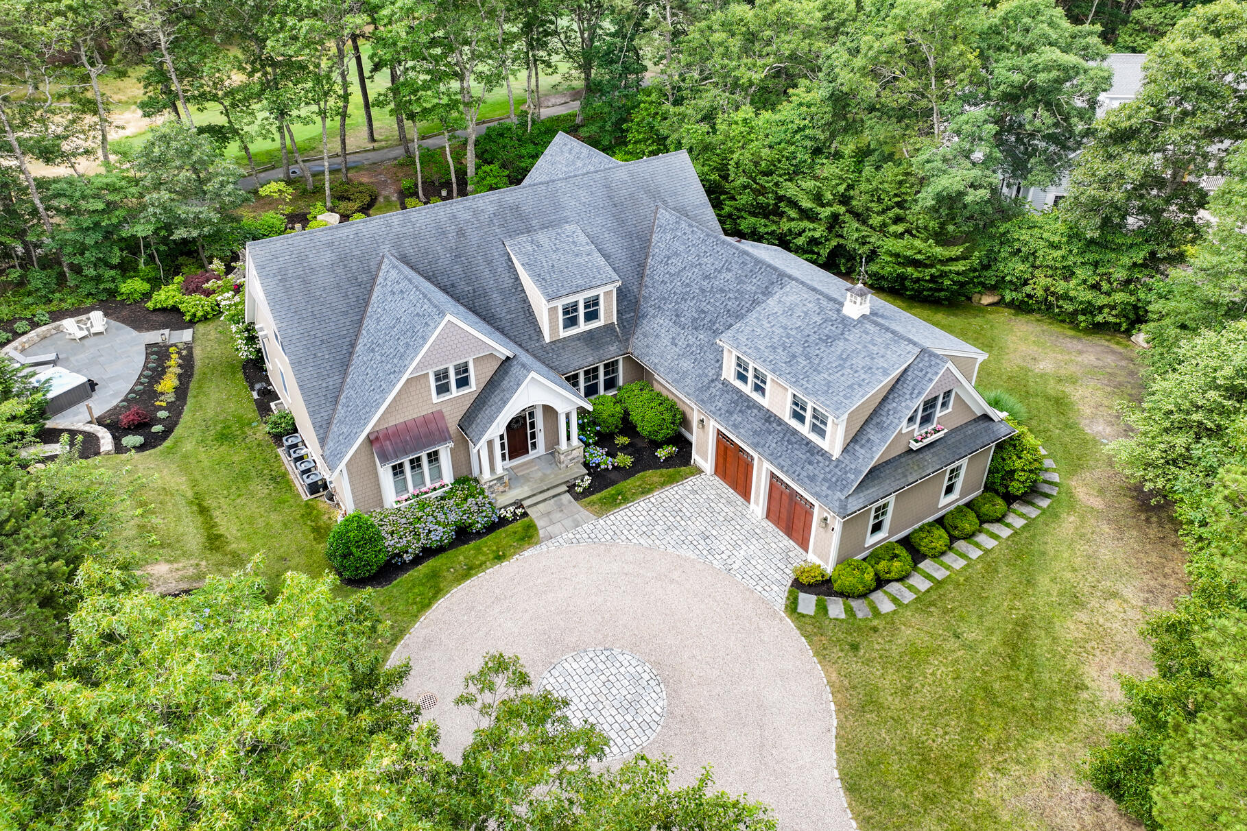 an aerial view of a house with a garden and trees