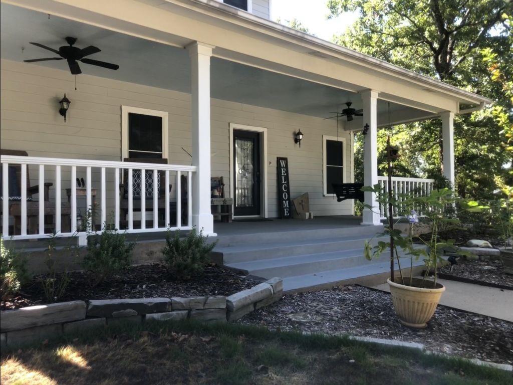 a view of a house with porch and sitting area