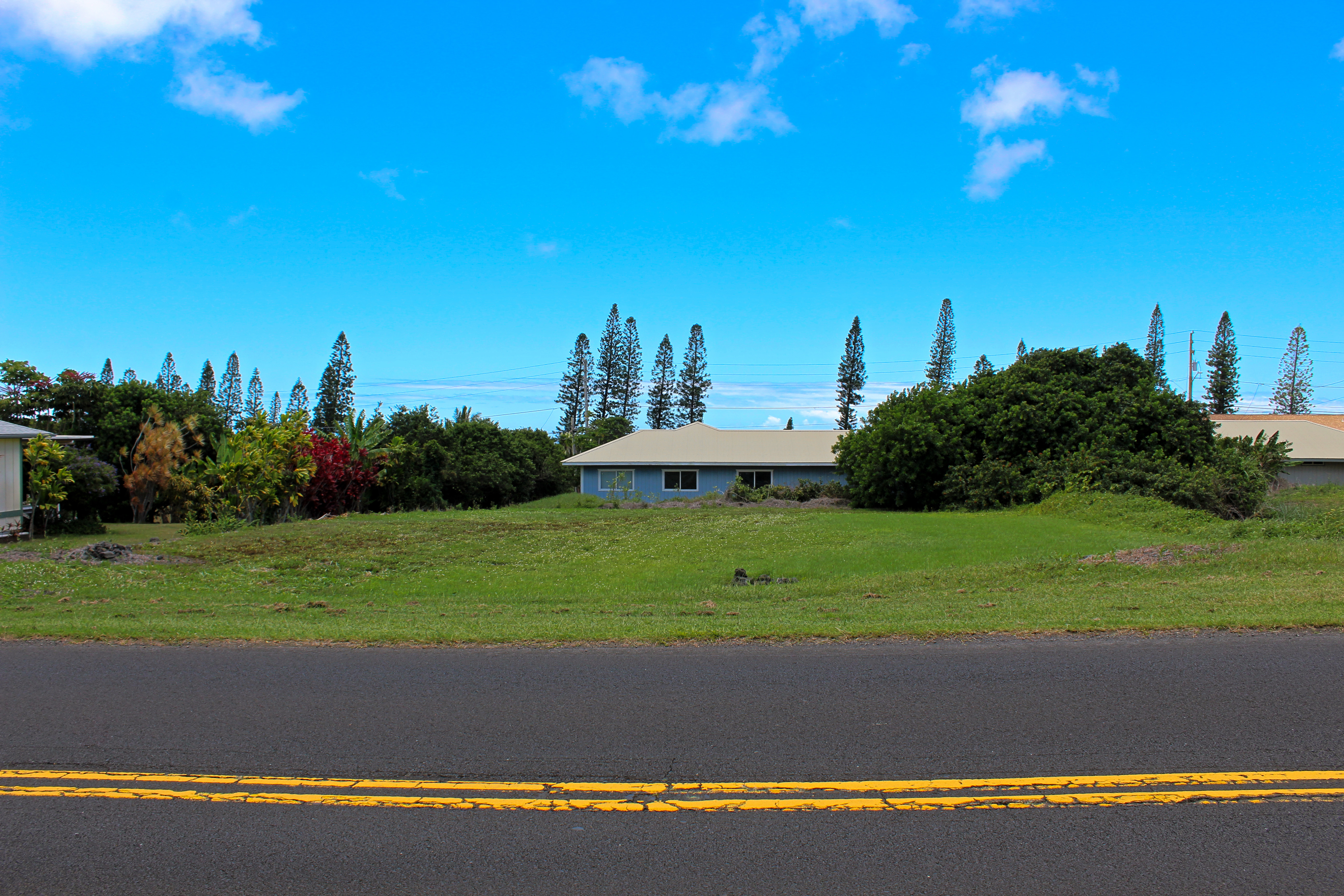 a view of a golf course with a house