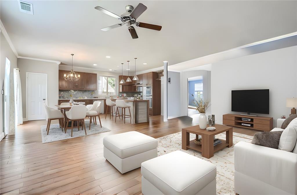 a living room with furniture and a flat screen tv