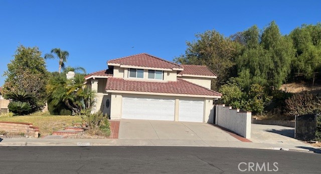 a front view of a house with a garage