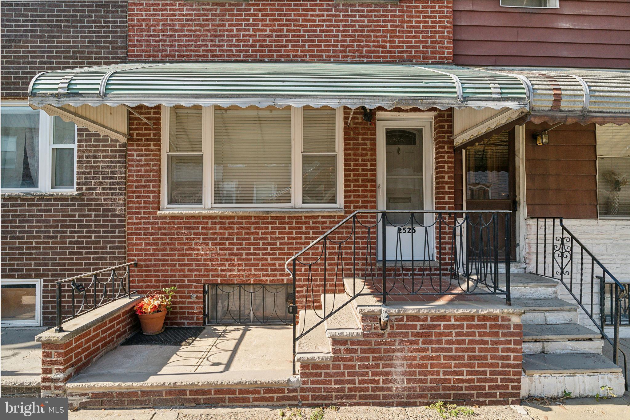 a view of a brick house with a window