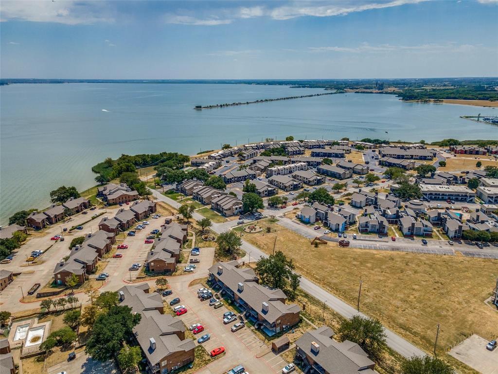 an aerial view of a house with a lake view