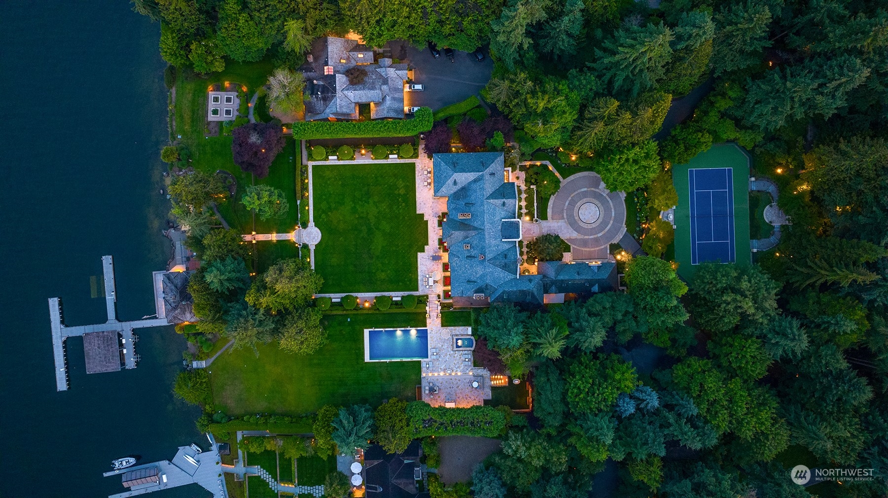 an aerial view of house with yard swimming pool and outdoor seating