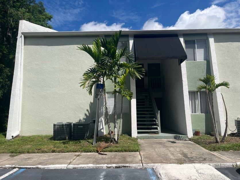 a couple of potted plants in front of door