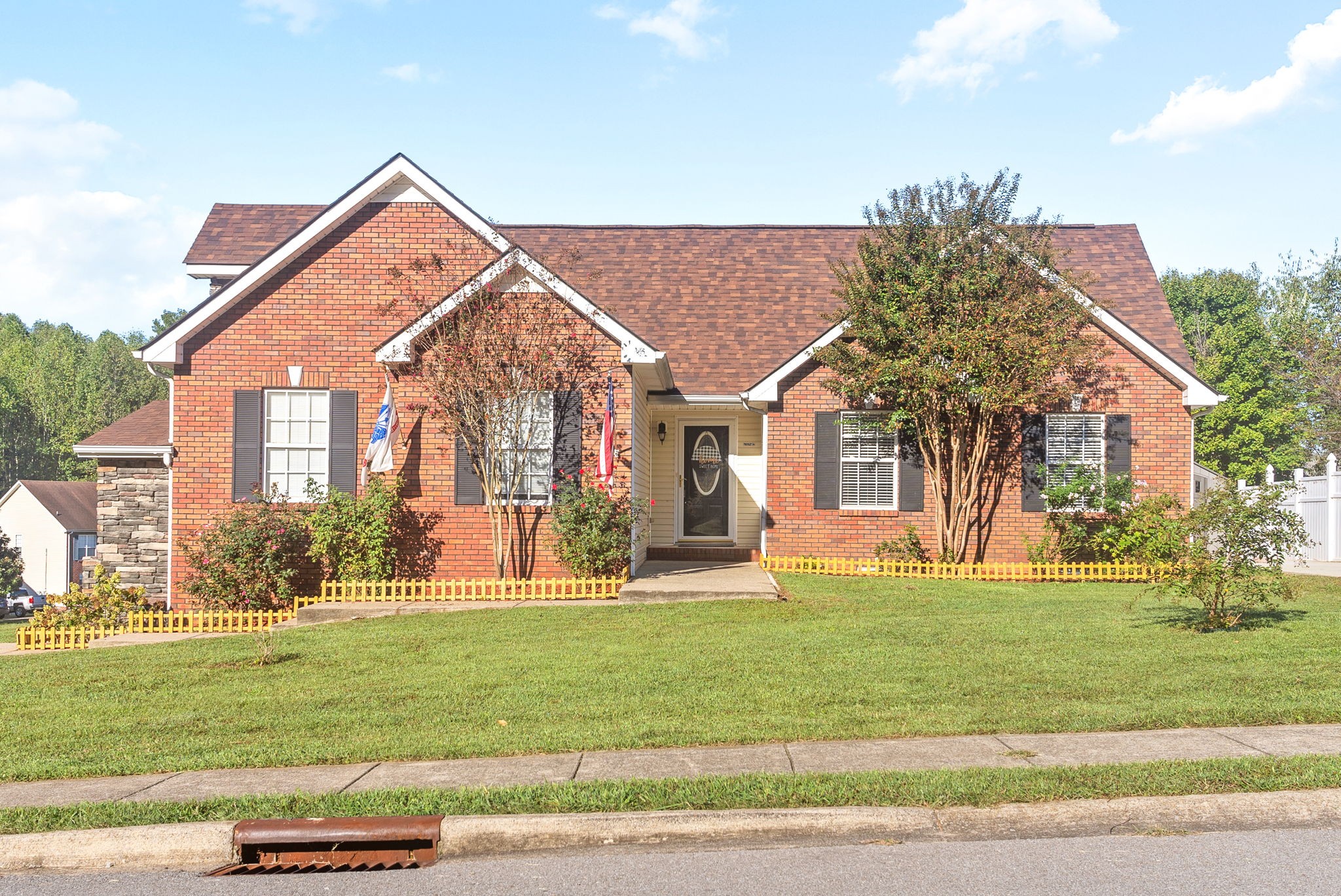 a front view of a house with a yard