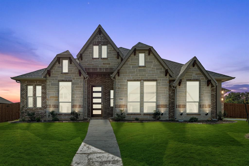 a front view of a house with a yard