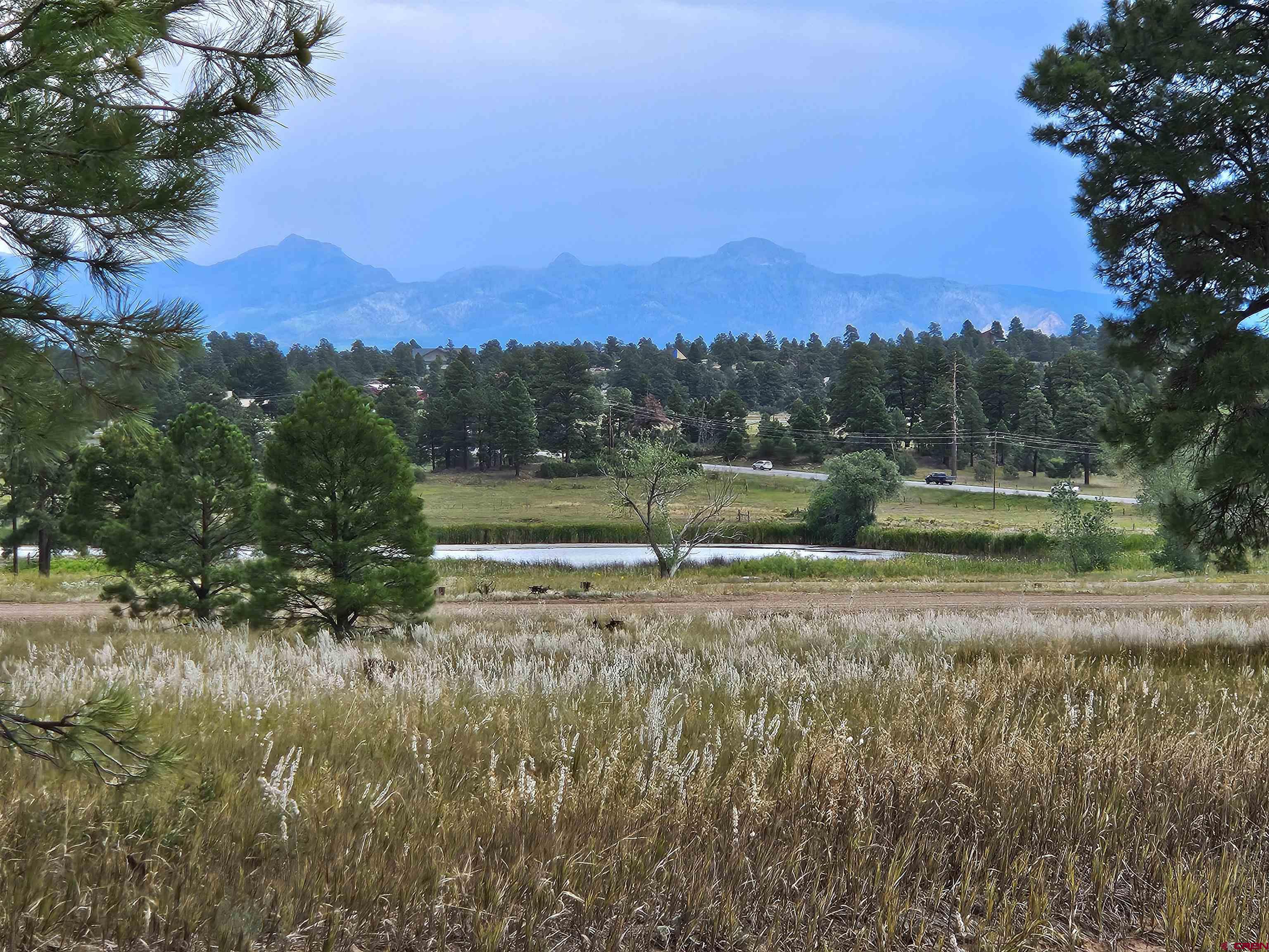 a view of a town with mountains in the background