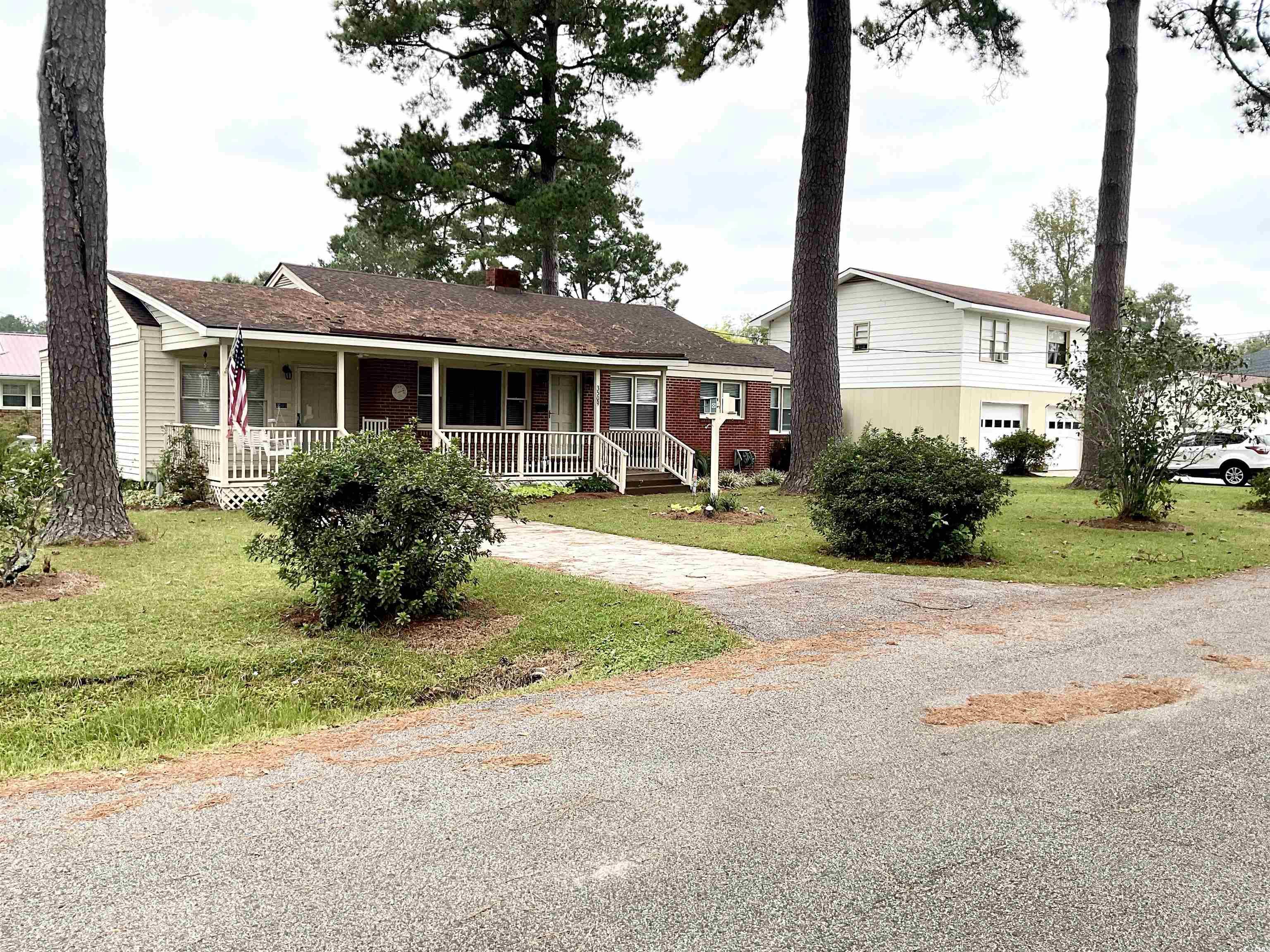 View of front of property with a front yard and a