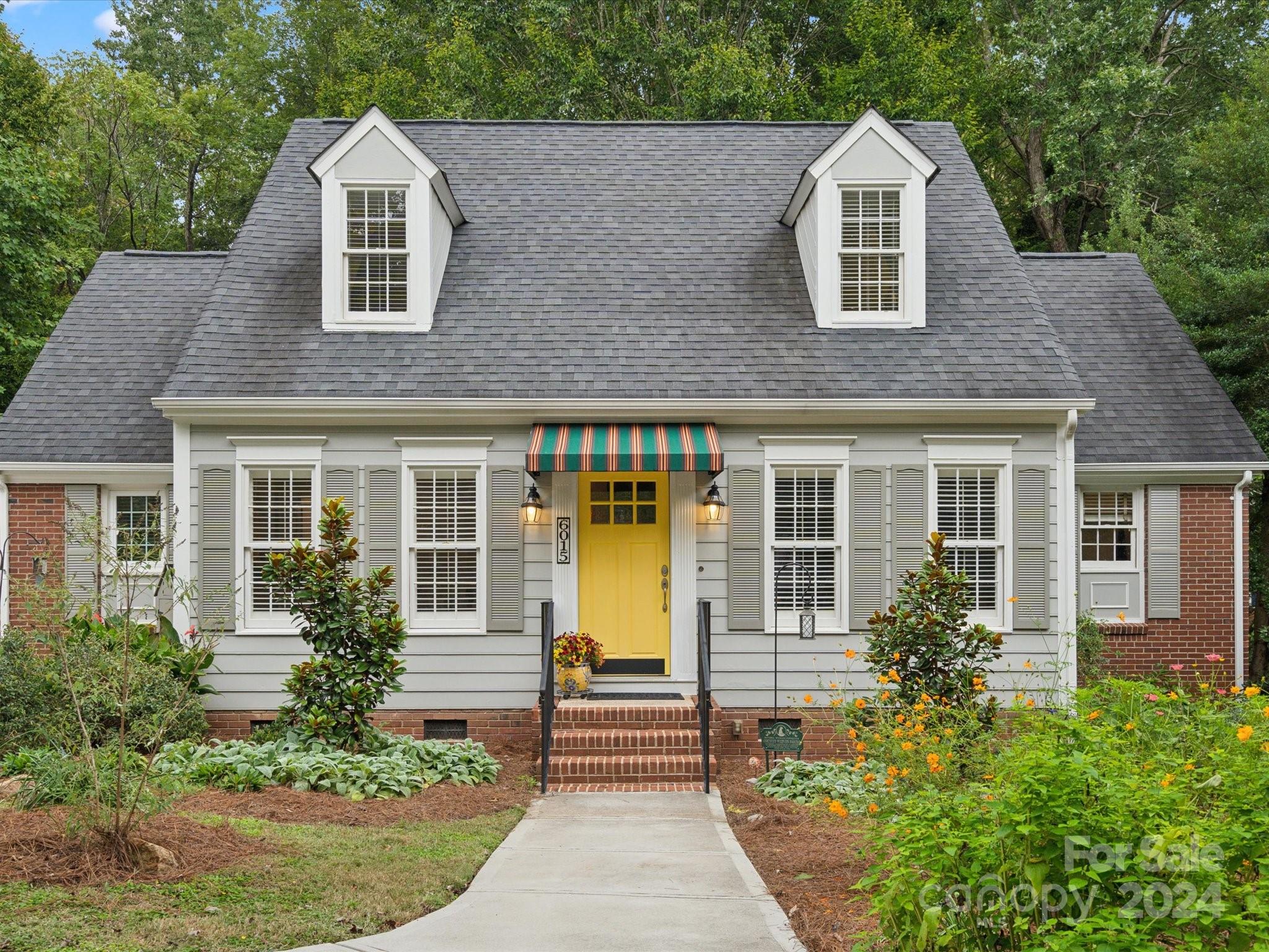 front view of a house with a yard