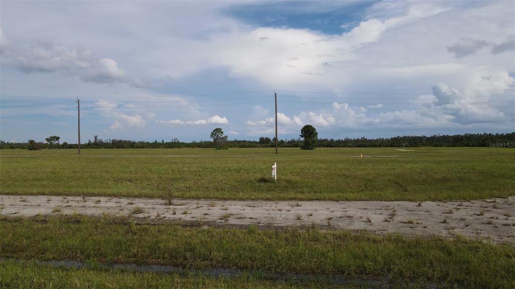 a view of a lake with a big yard