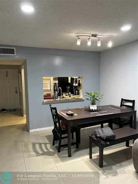 a view of a room with furniture and window