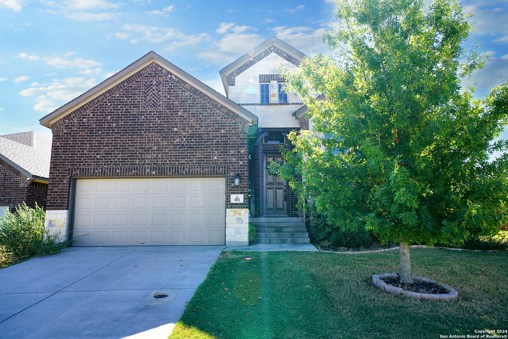 front view of a house with a yard