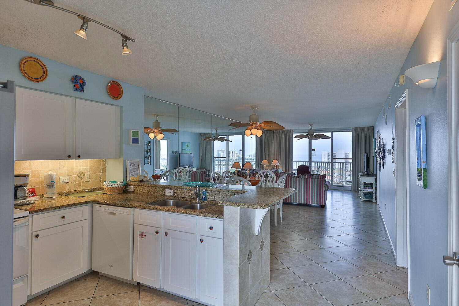 a very nice looking open kitchen with a large window