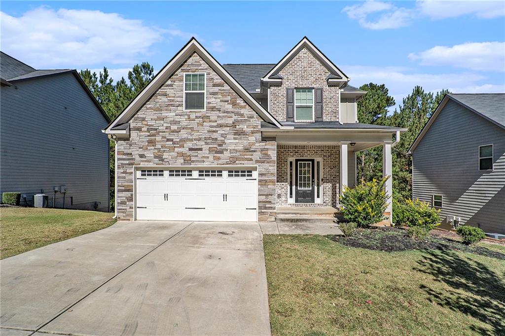 front view of a house with a yard