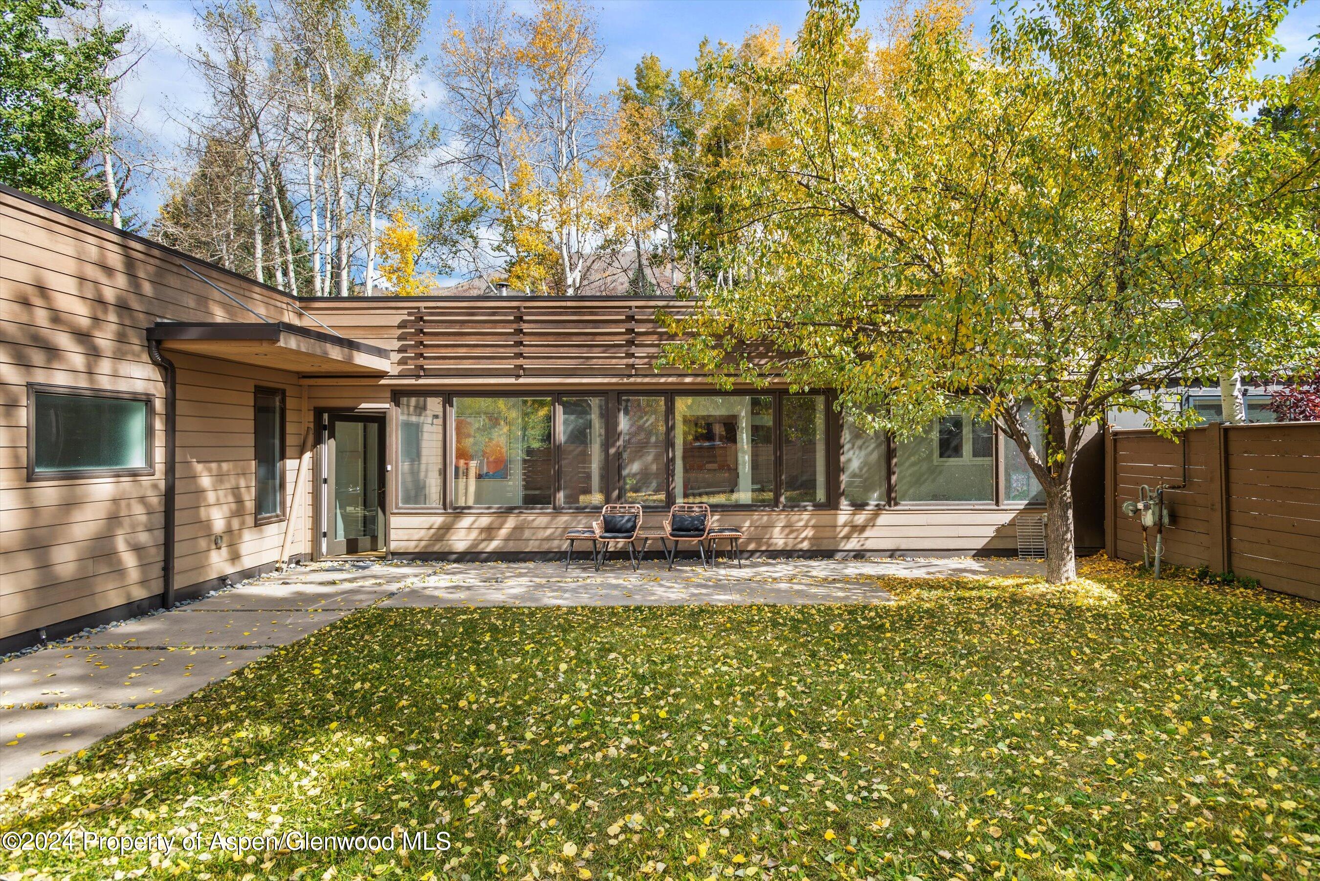 a house view with a sitting space and garden space