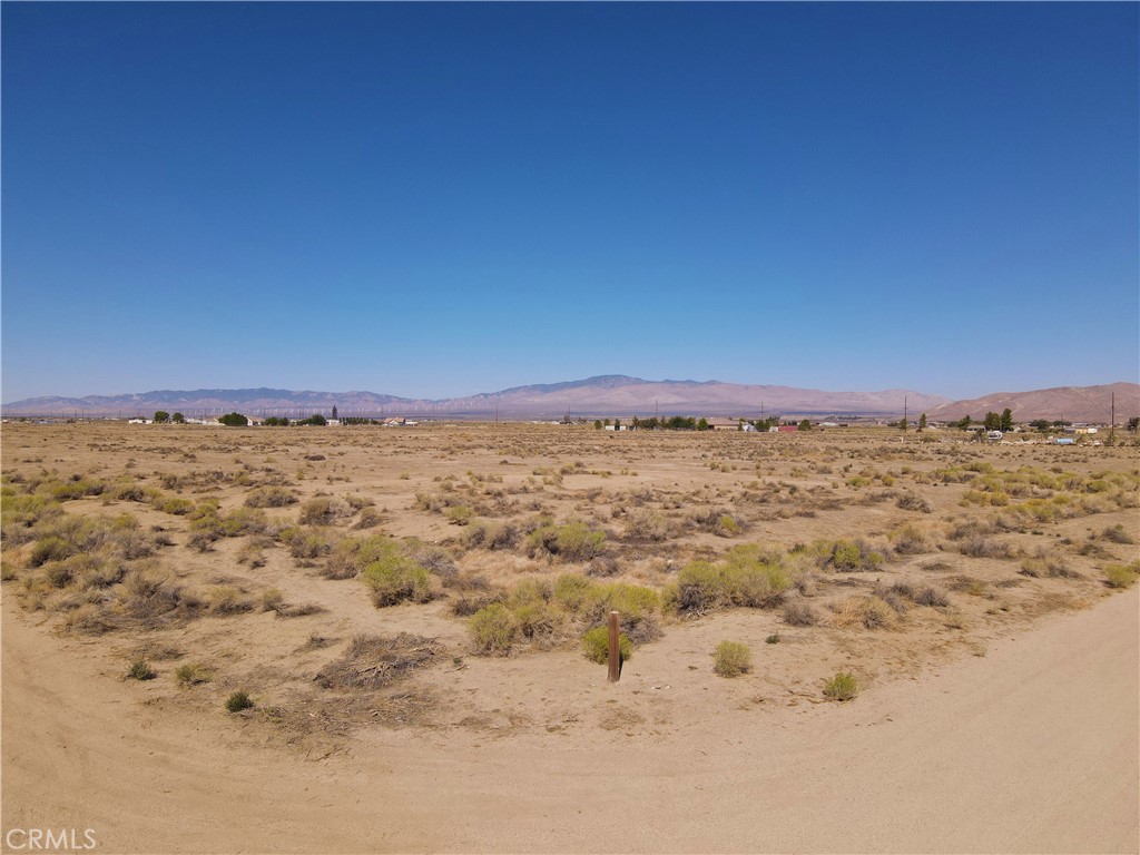 a view of a large screen of mountains with in the background