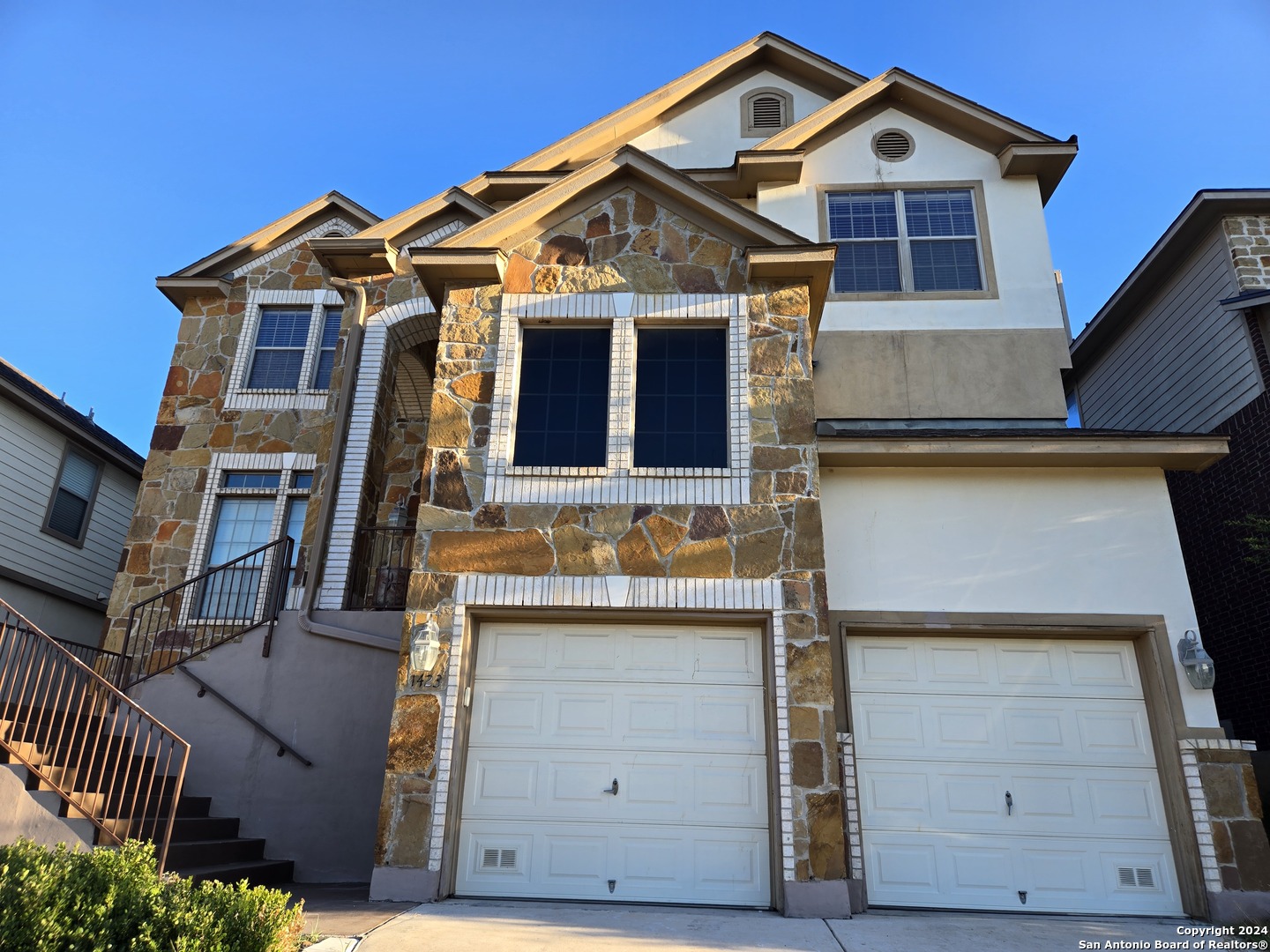 a front view of a house with a garage