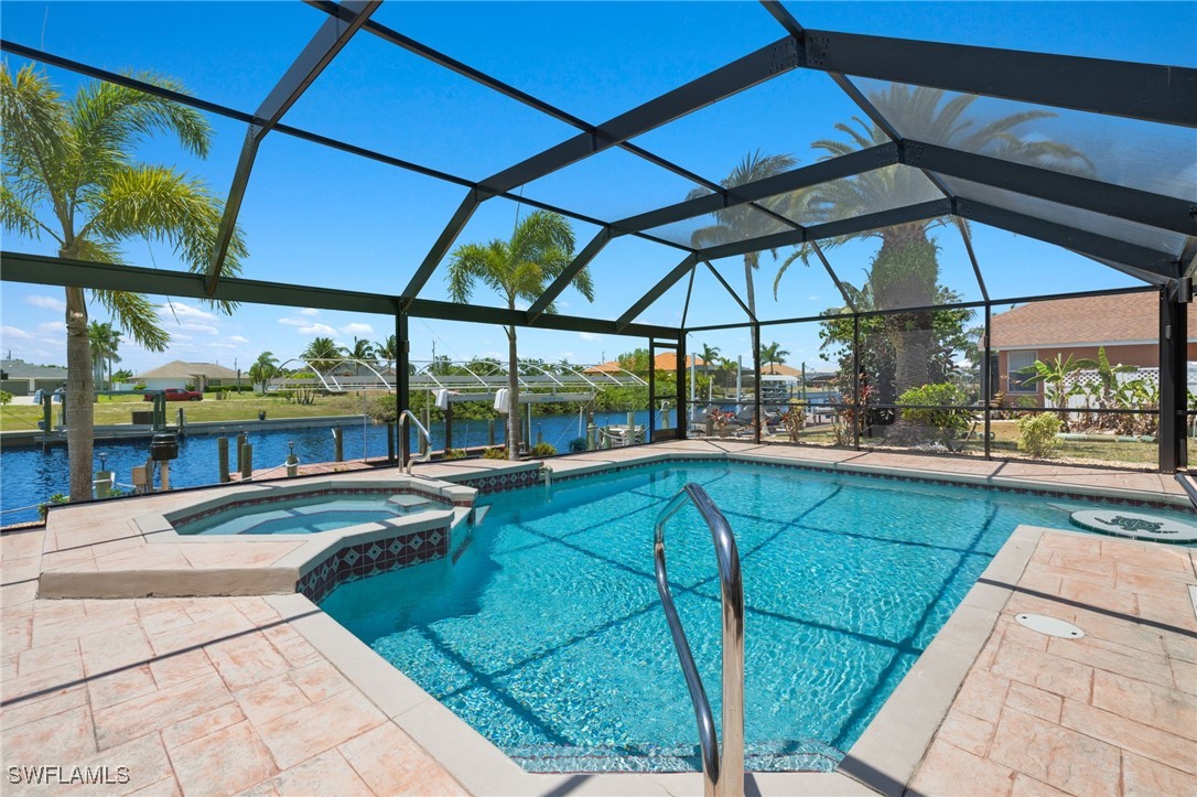 a view of swimming pool with outdoor seating