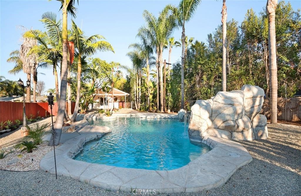 a view of a swimming pool with sitting area