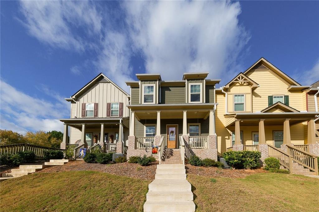 a front view of a house with a yard