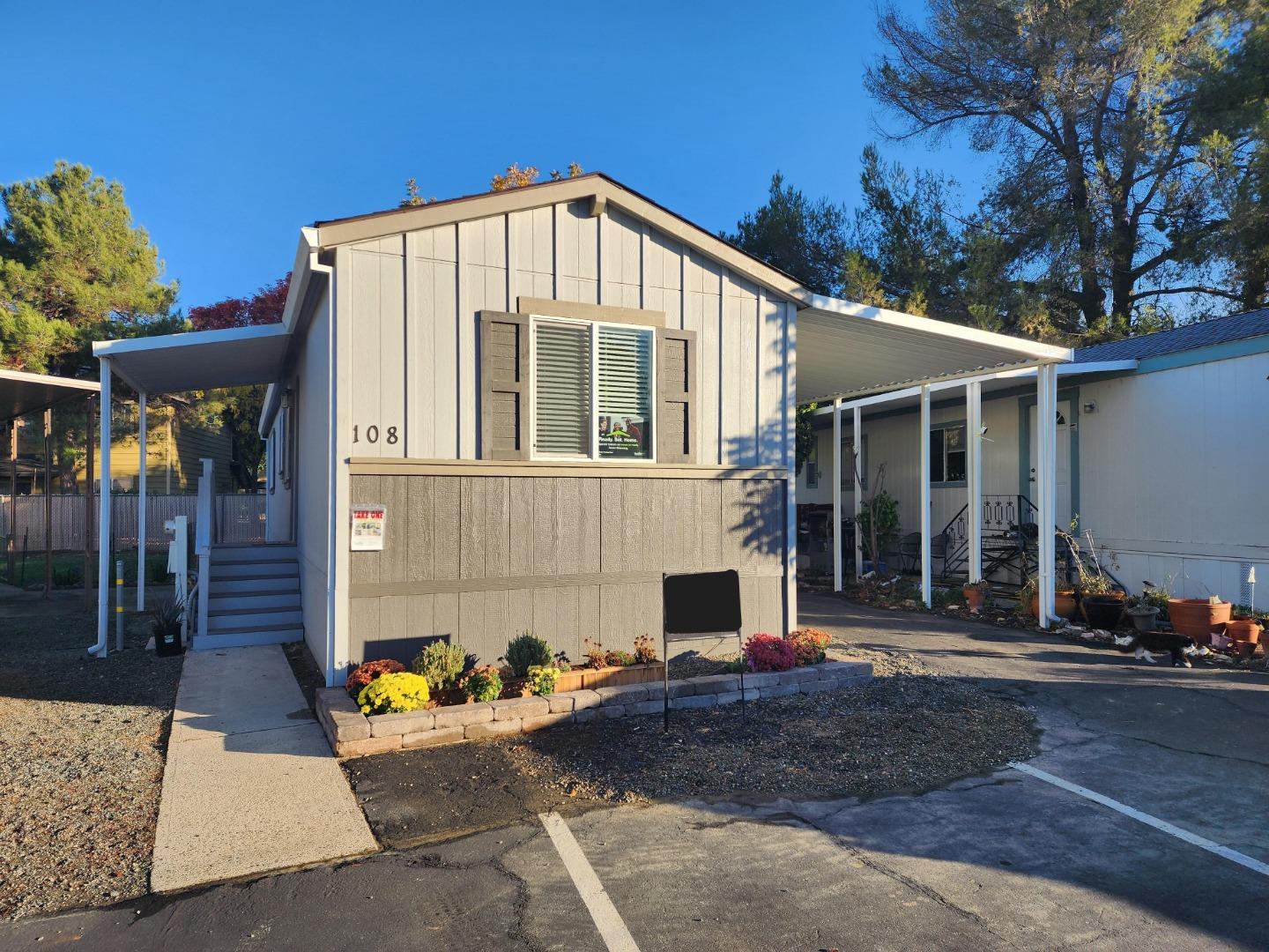 a front view of a house with garden