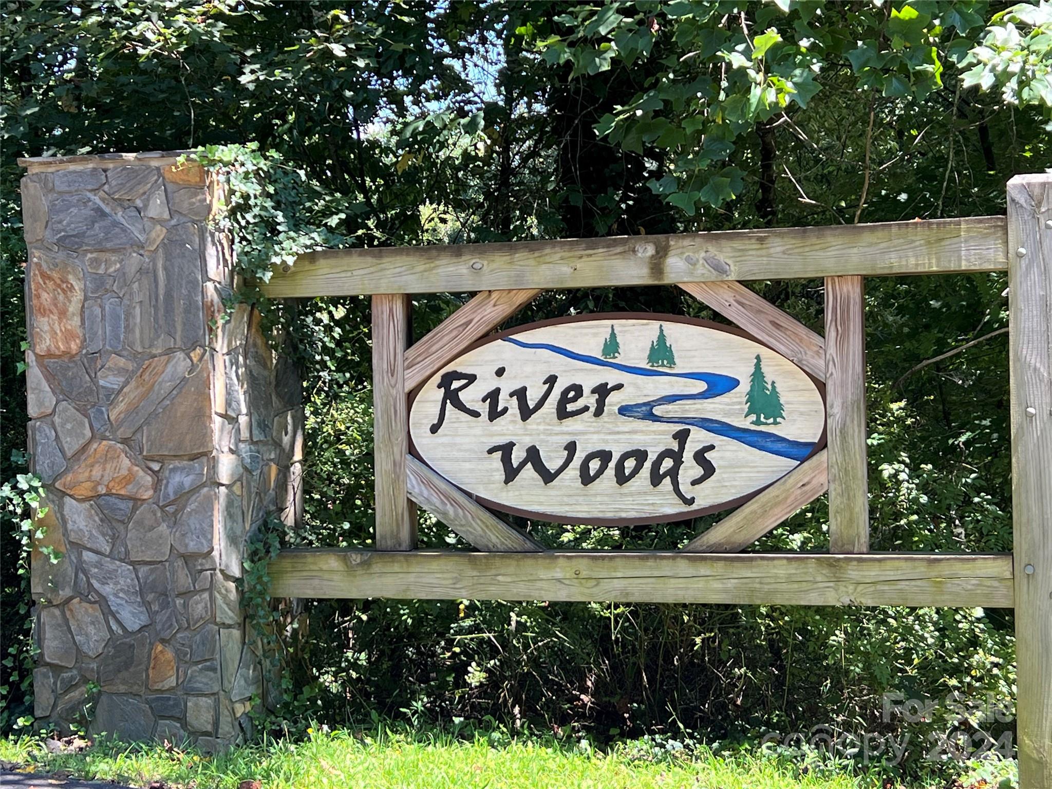 a view of sign board with flower around