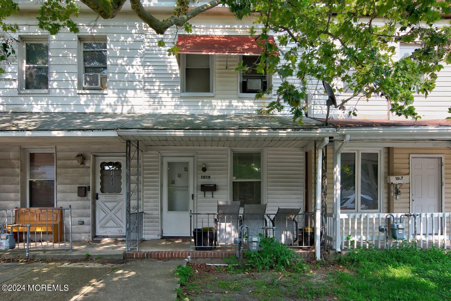 a front view of a house with yard