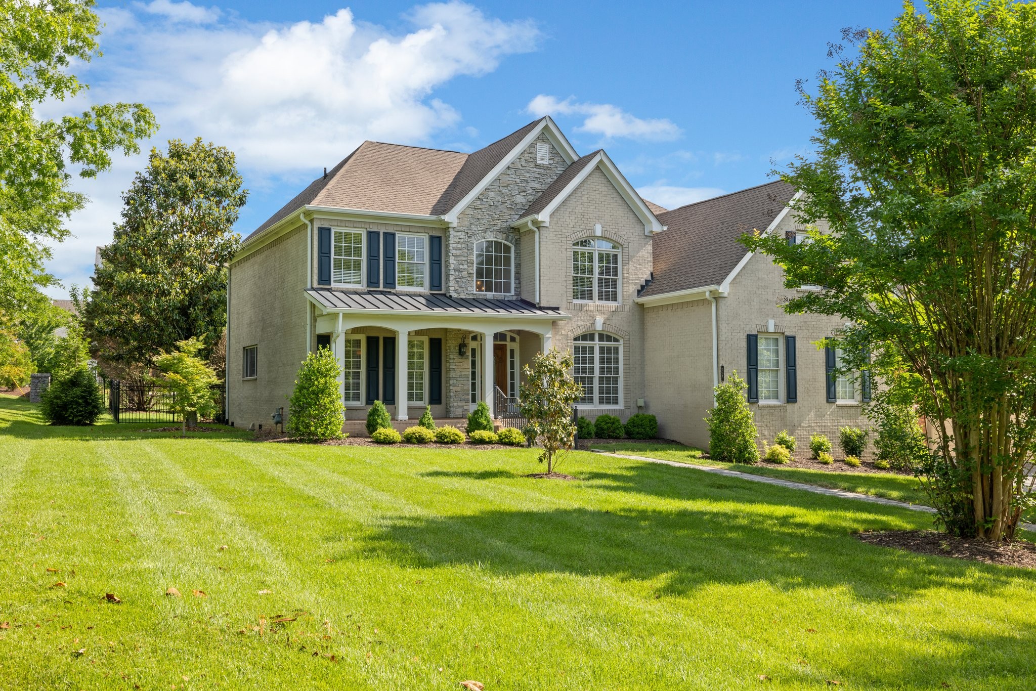 a front view of a house with a yard