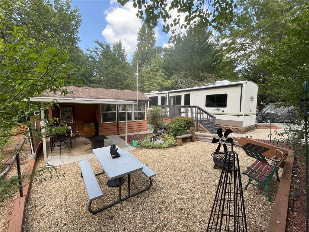 a house view with a sitting space and garden space