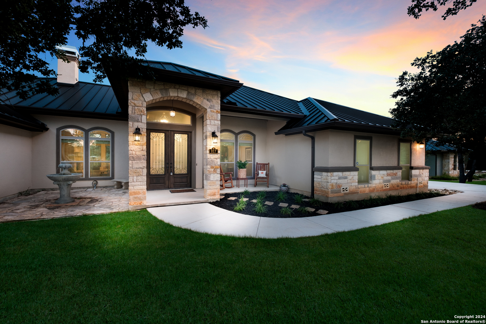 a front view of house and yard with seating space