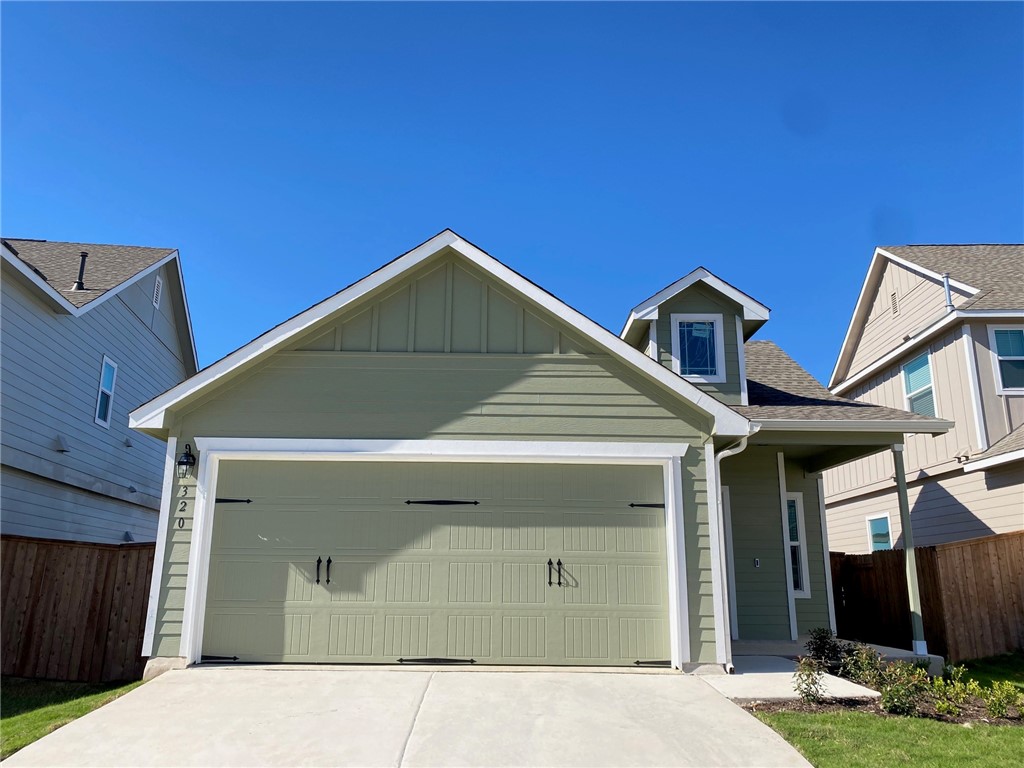 a view of a house with a garage