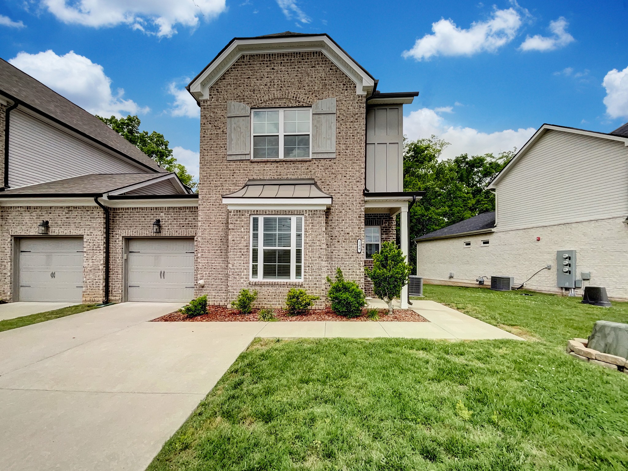 a front view of a house with a yard