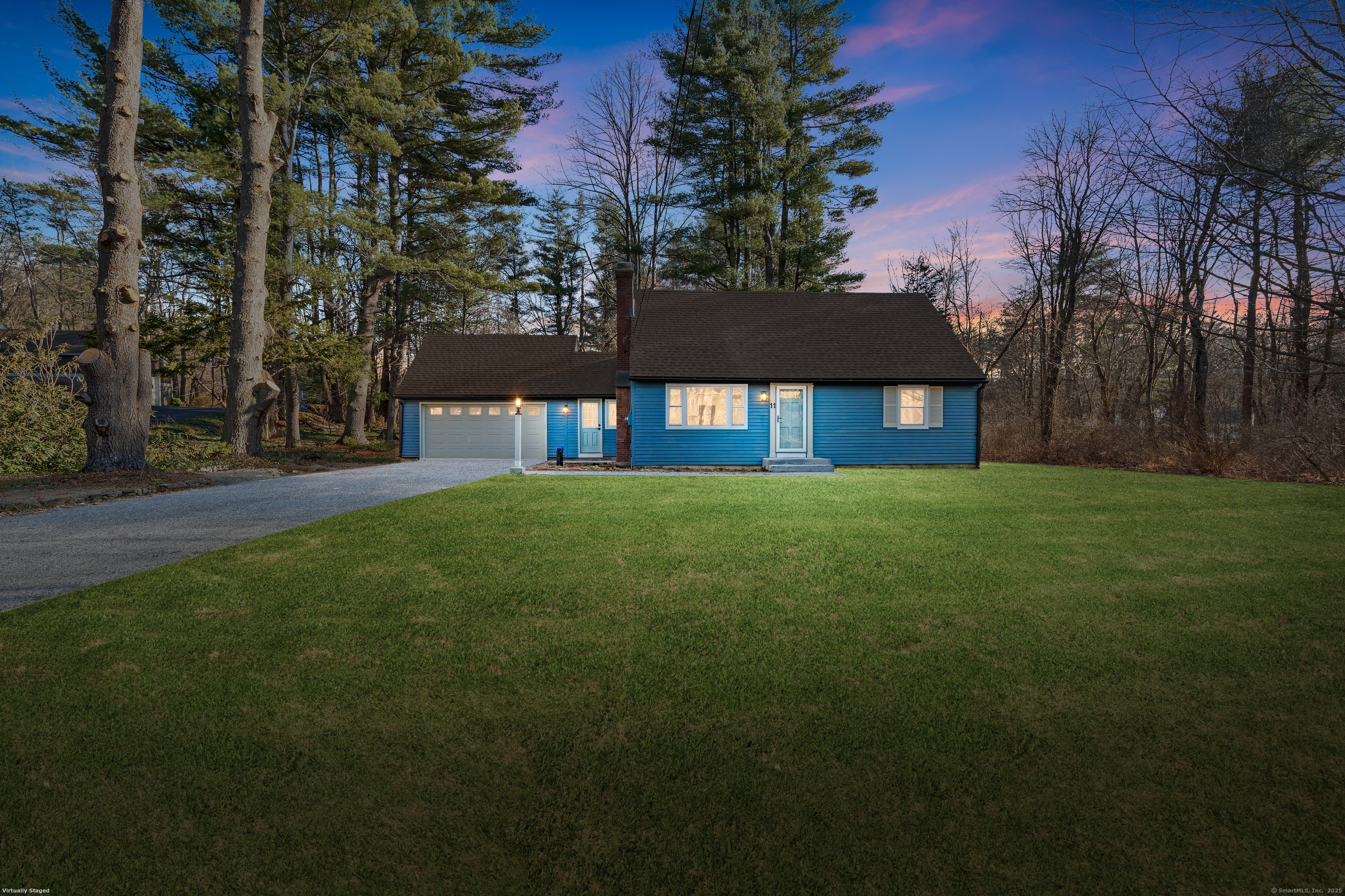 a view of house with a yard