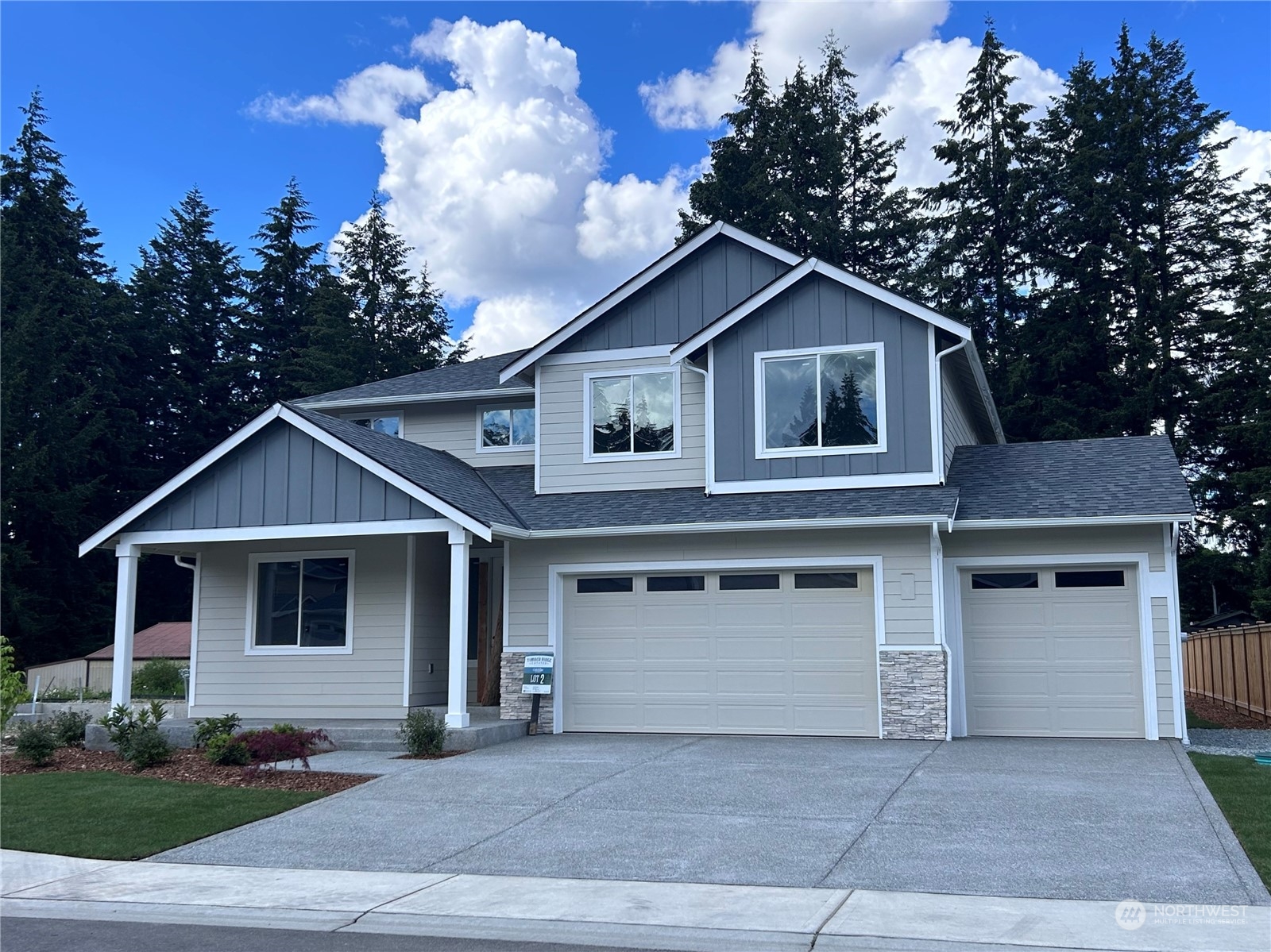 a front view of a house with garage