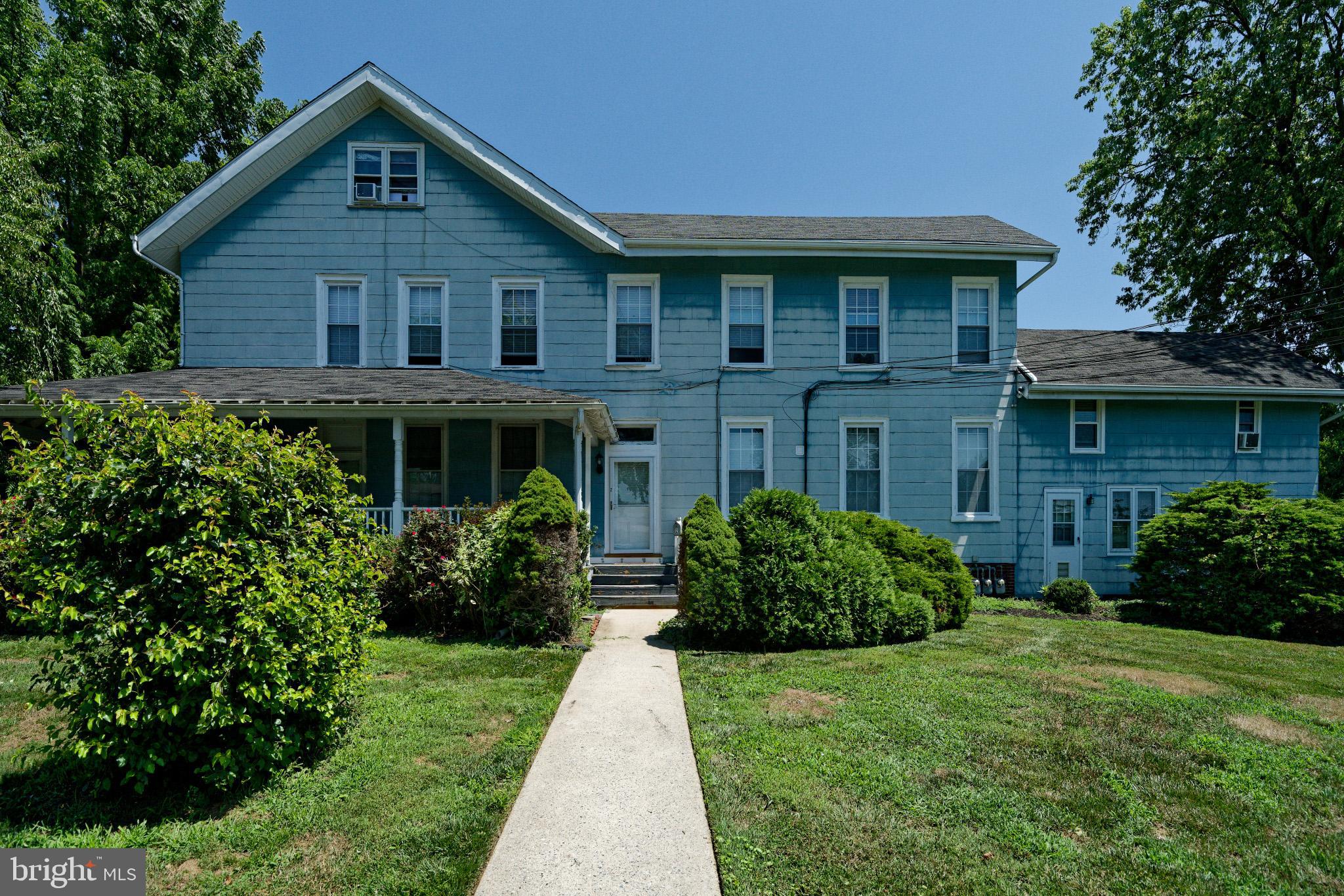 a view of a house with garden and yard