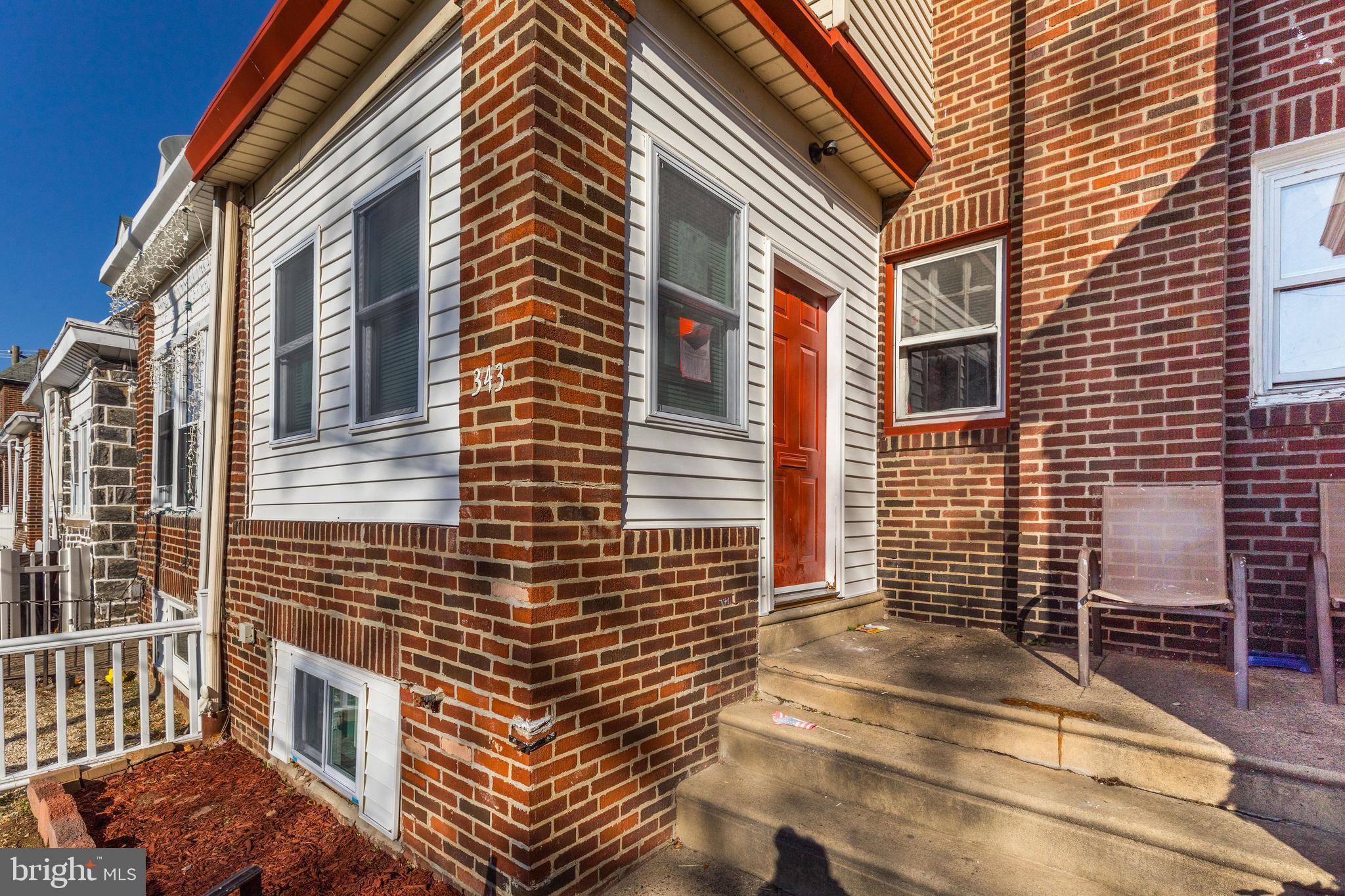 a view of a brick building with many windows