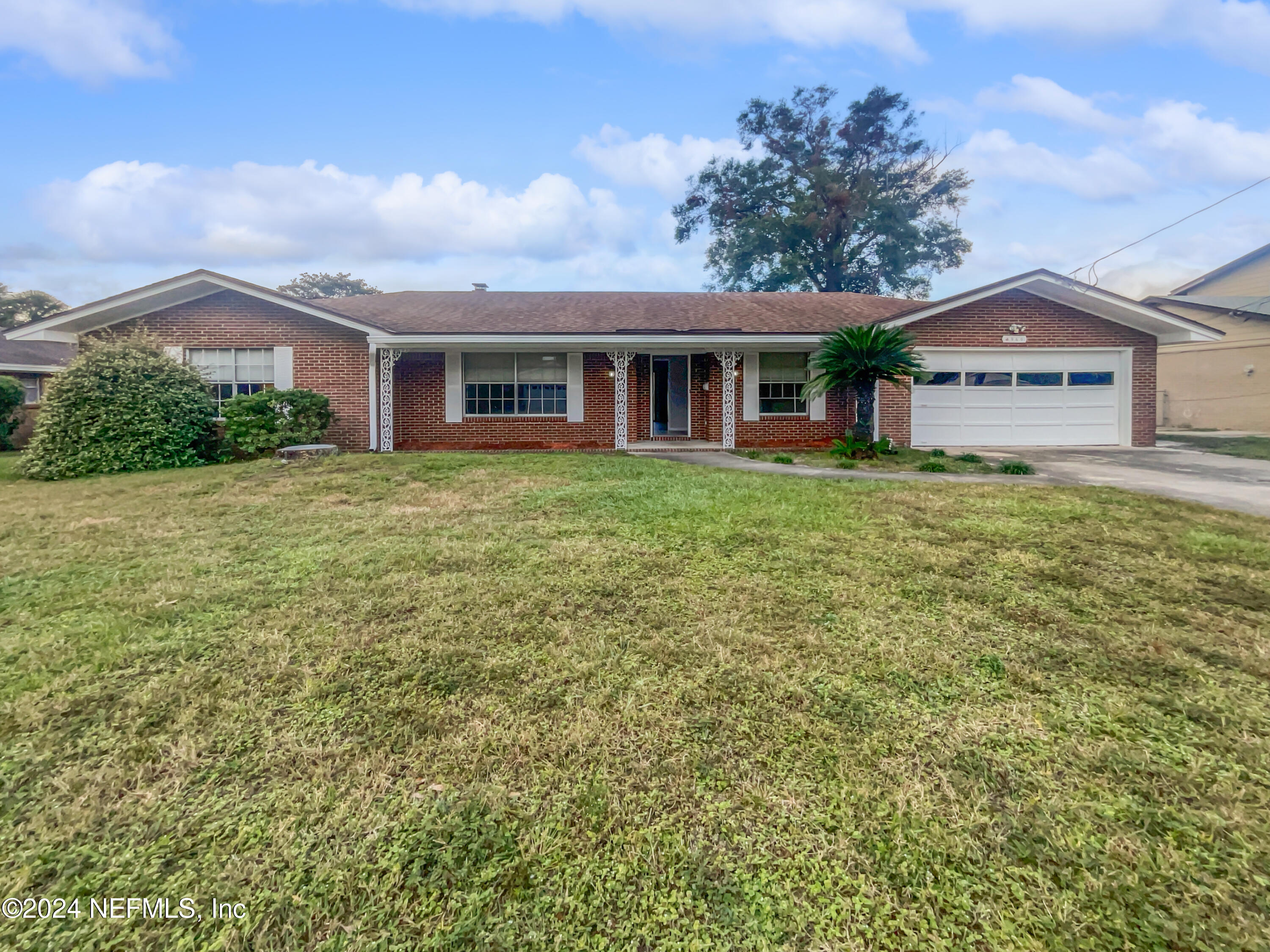 front view of a house with a yard