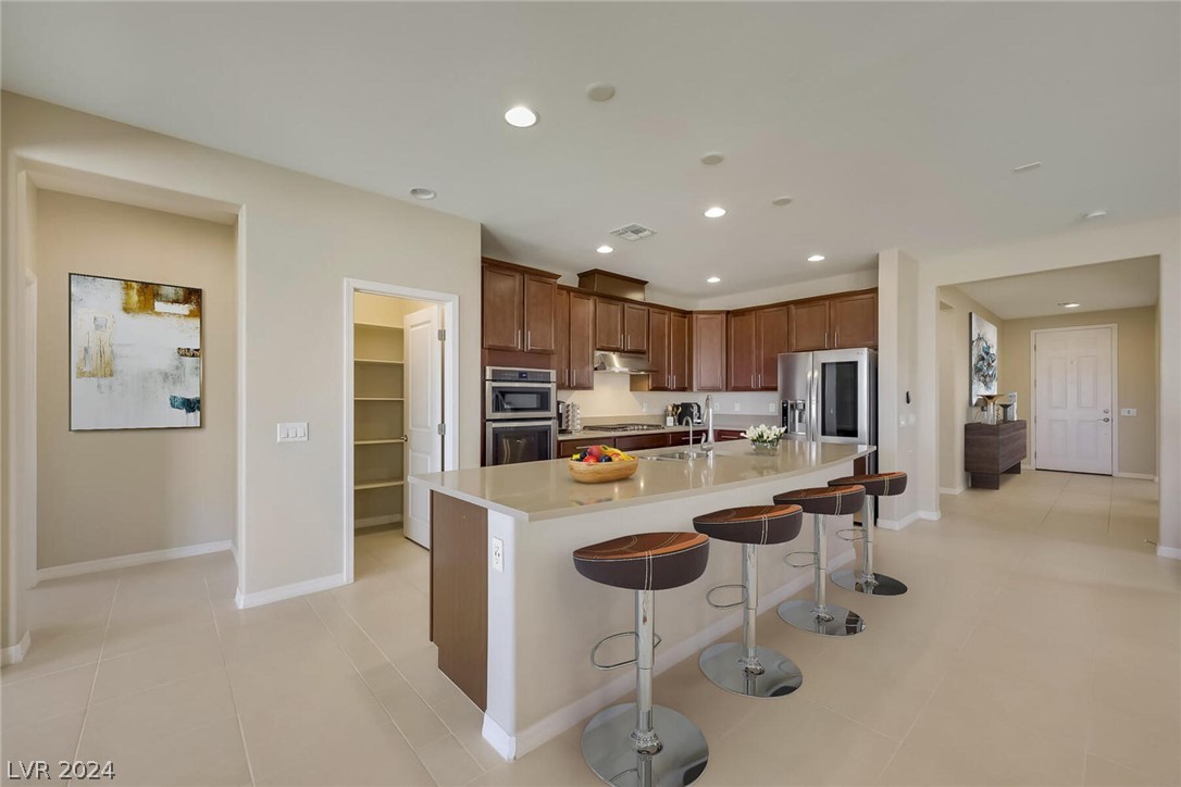 Virtually Staged. Large kitchen with recessed ligh