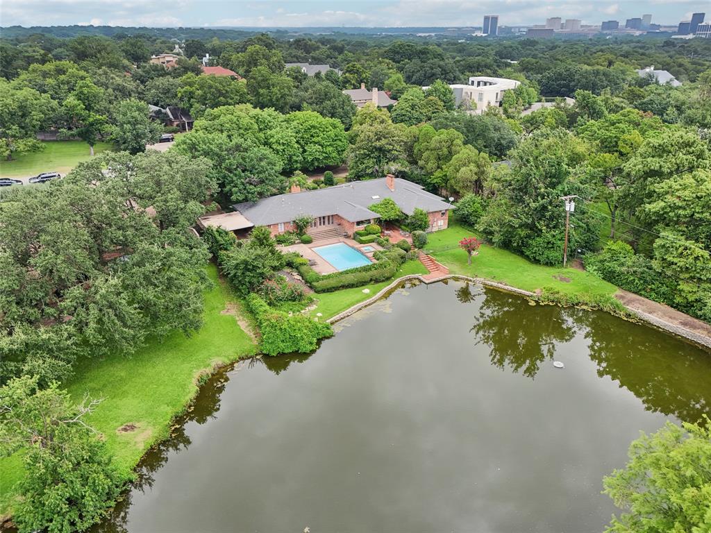 an aerial view of a houses with a lake view