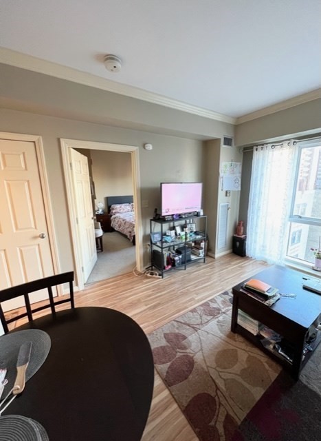 a living room with furniture and a flat screen tv