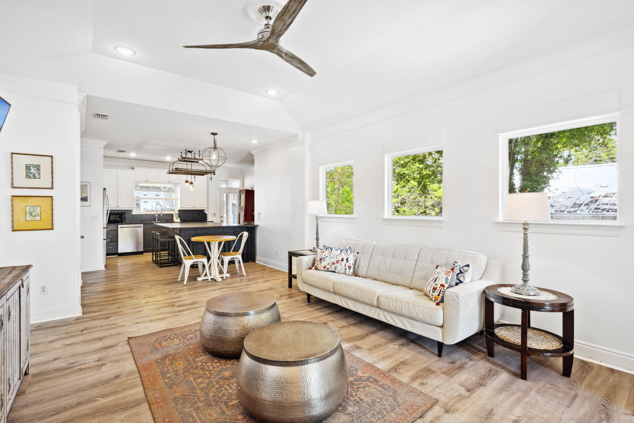 a living room with furniture and wooden floor