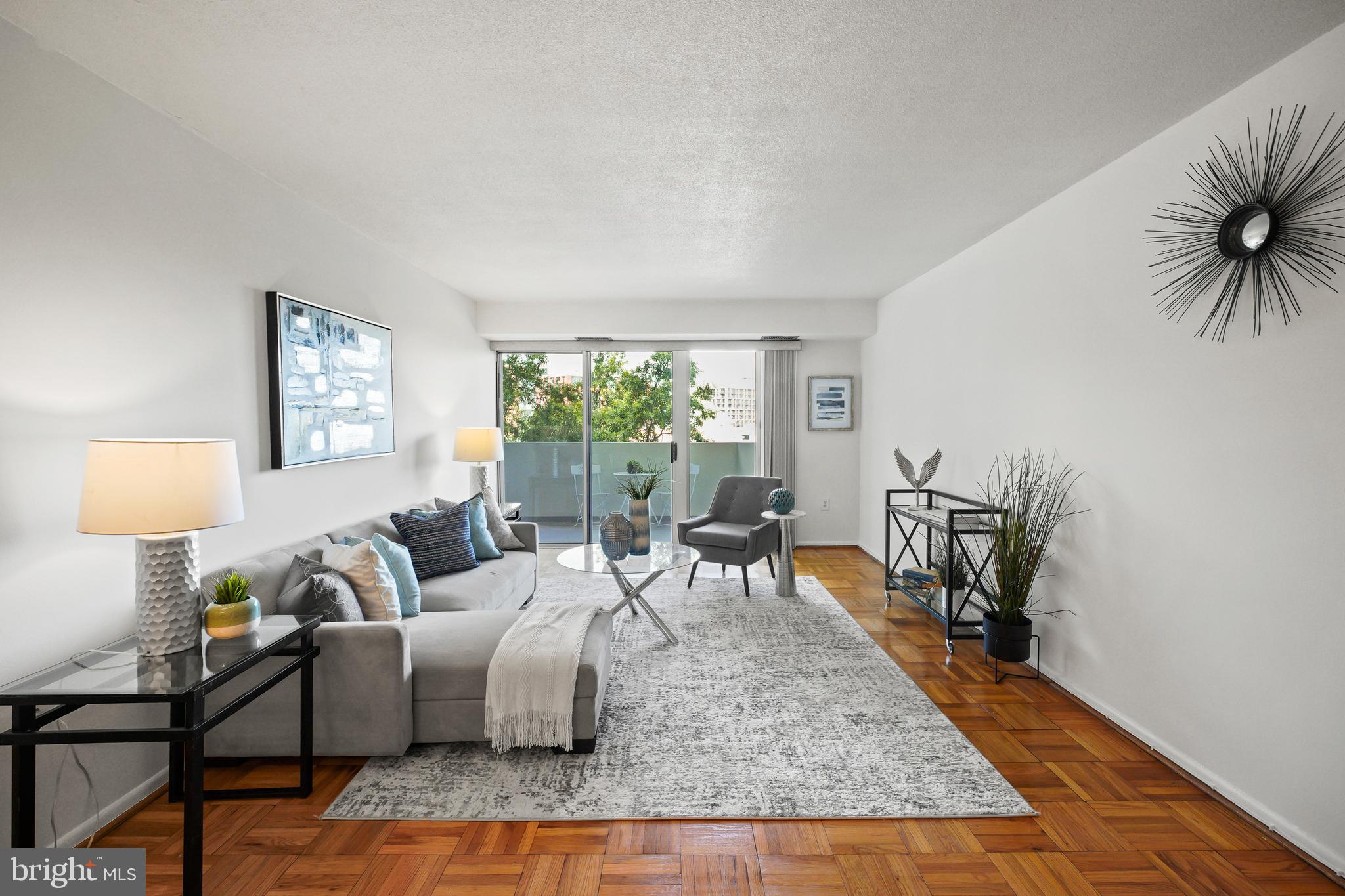 a living room with furniture and a table