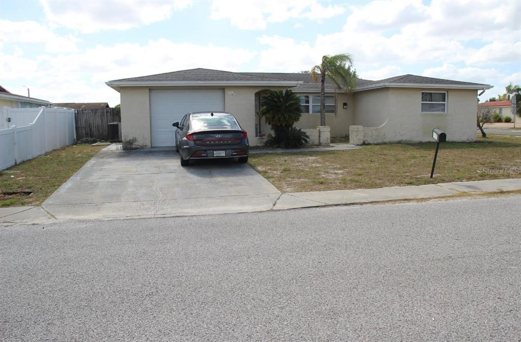 a car parked in front of a house