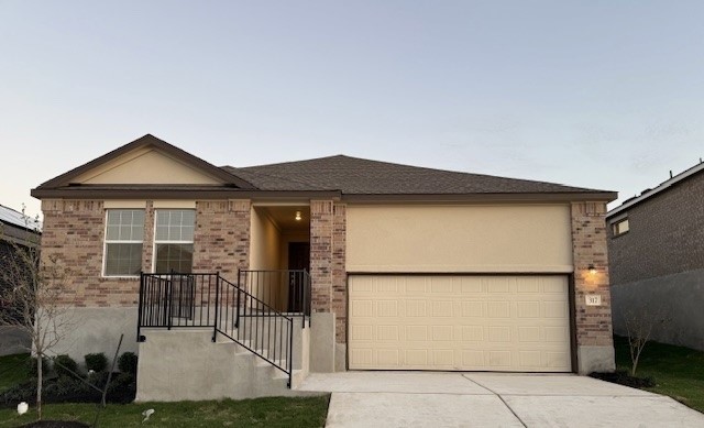 a view of a house with iron fence