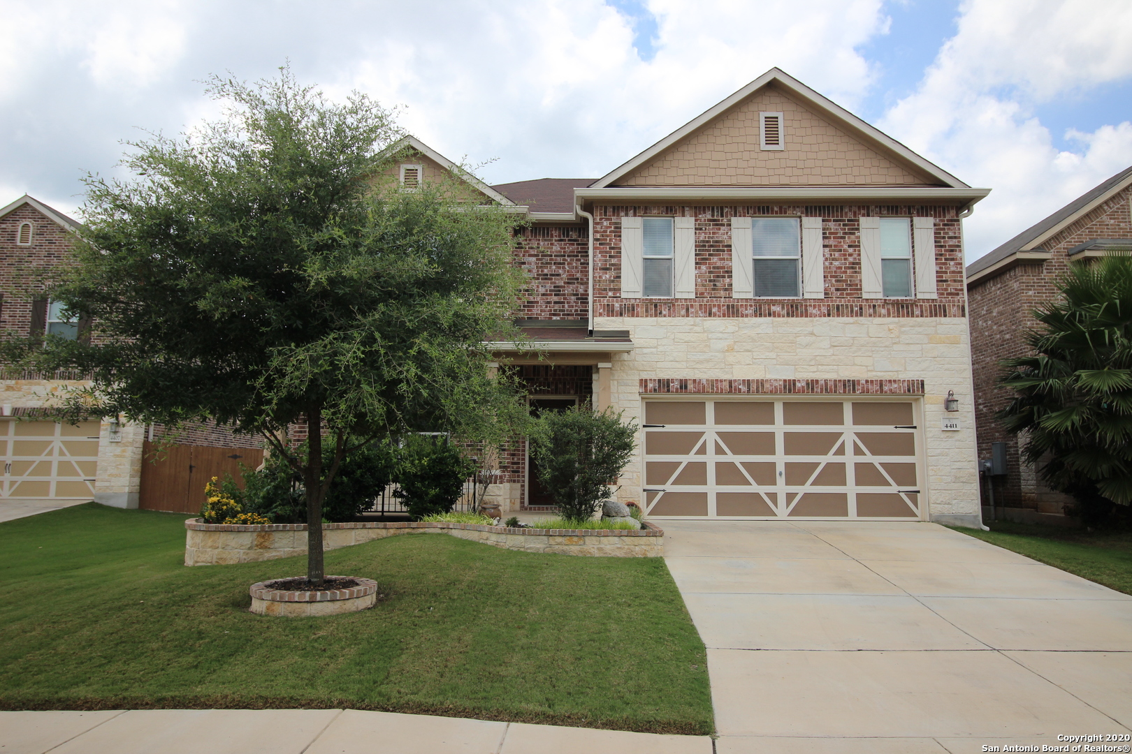 front view of a house with a yard