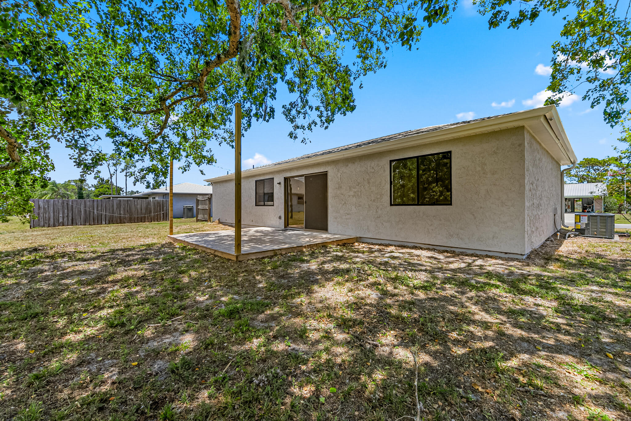 a view of a house with a tree