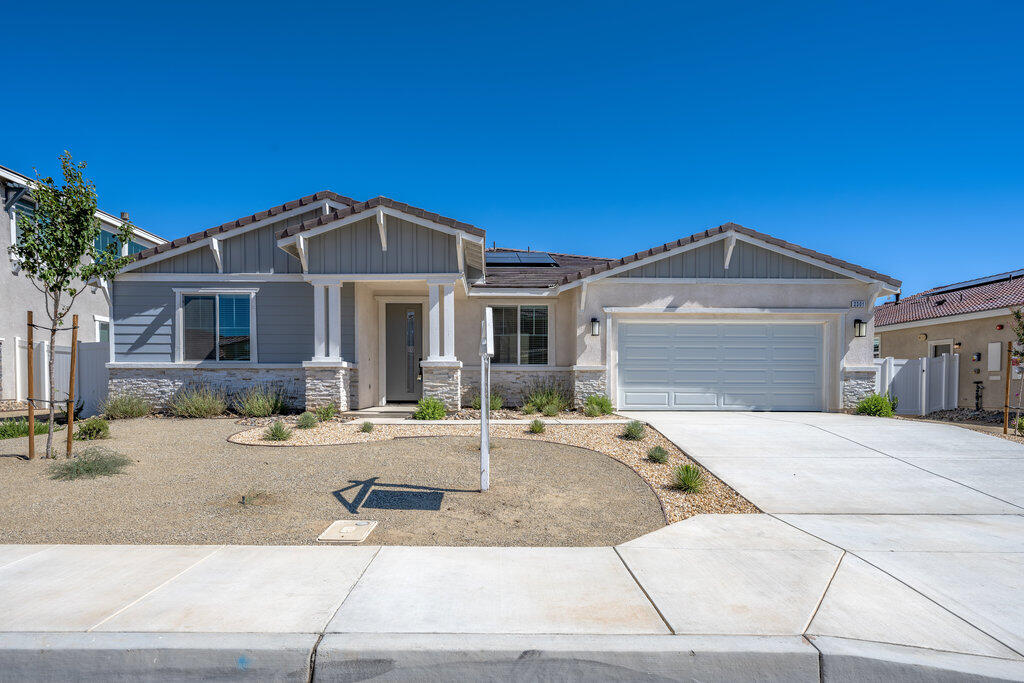 a front view of a house with a sitting space