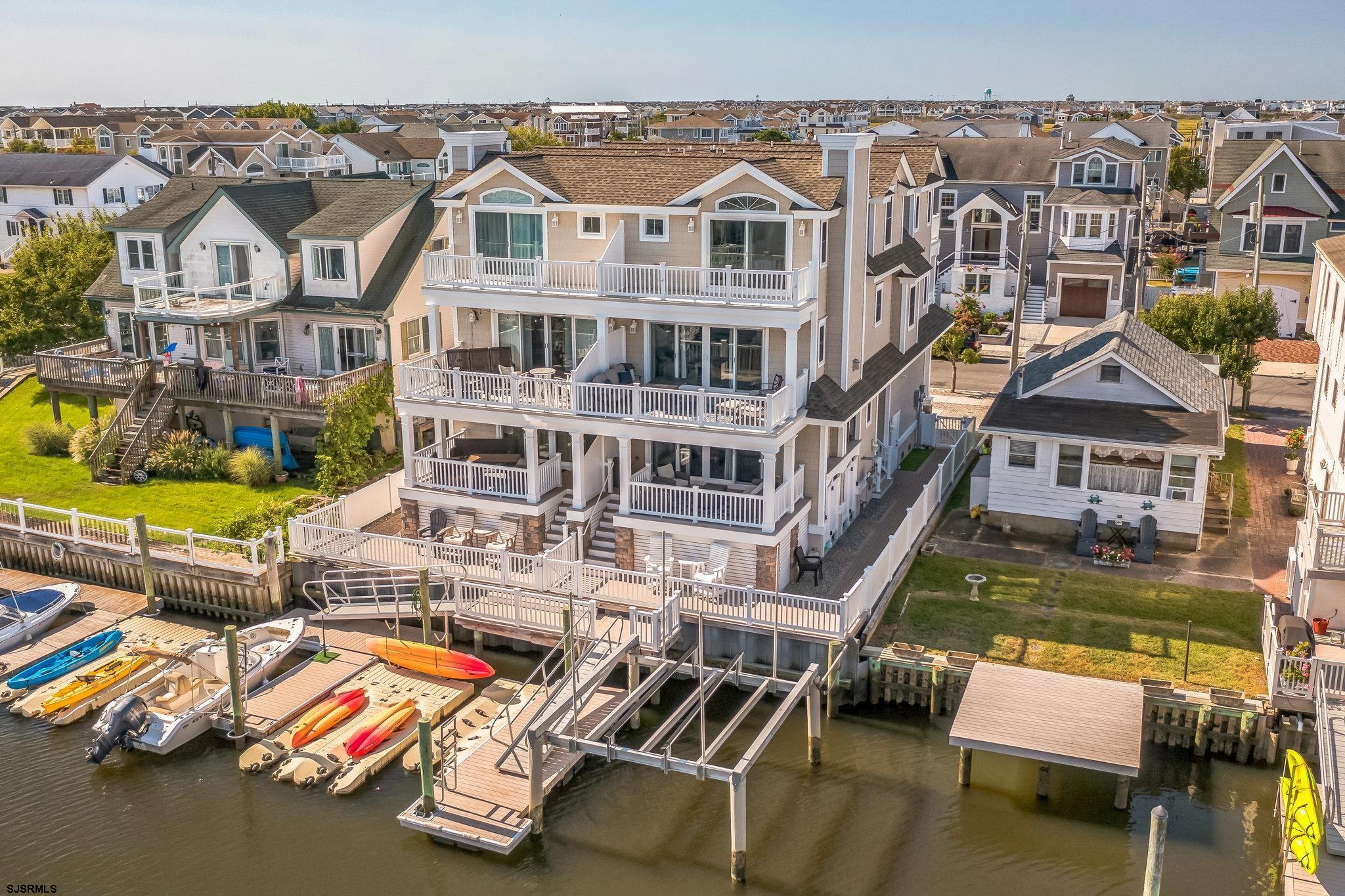 an aerial view of residential houses with yard