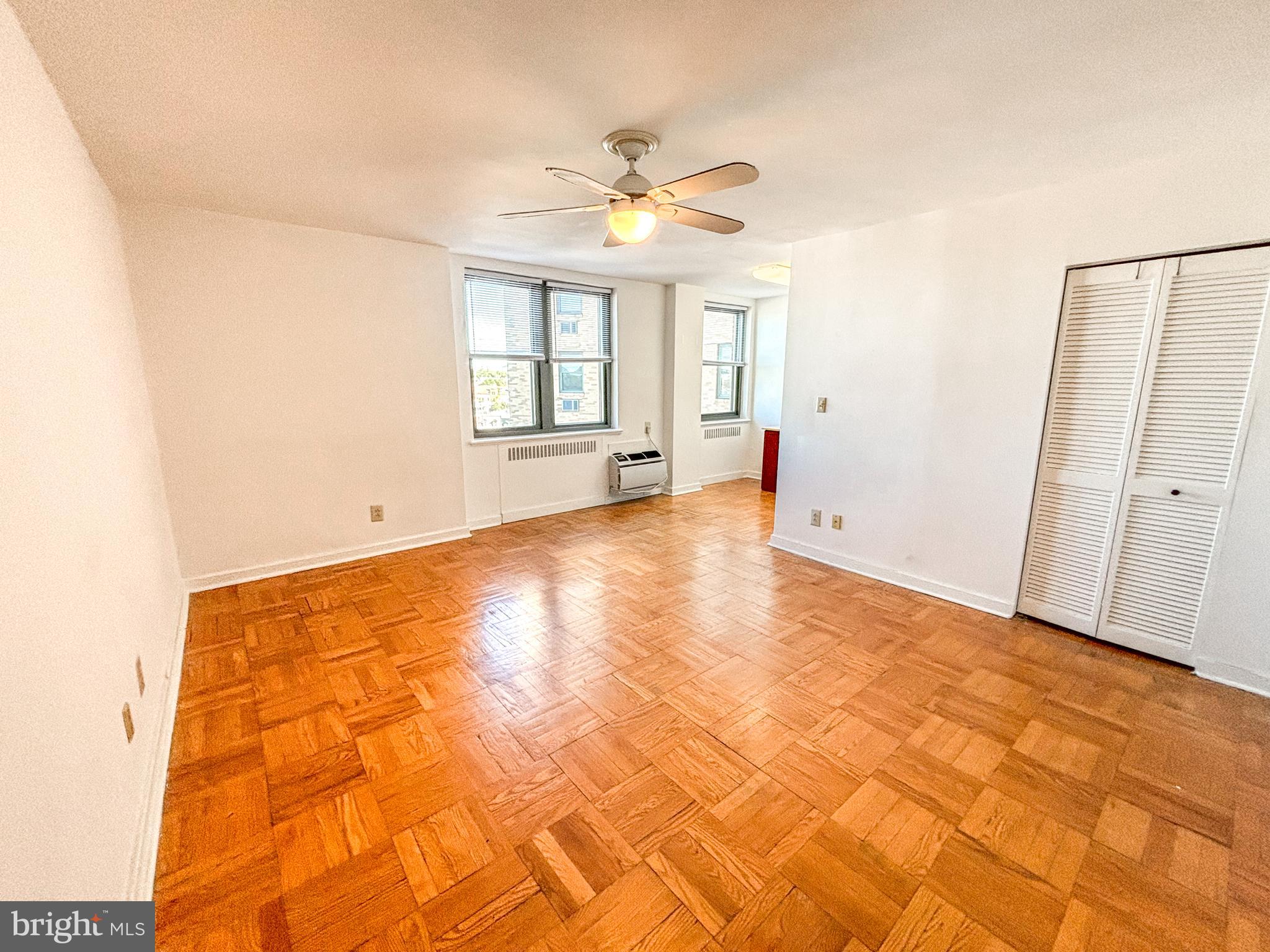 a view of an empty room with a window